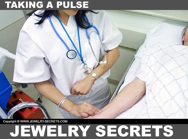 Nurse Taking A Pulse